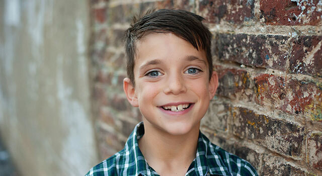 boy smiling for back to school eye exams.jpg